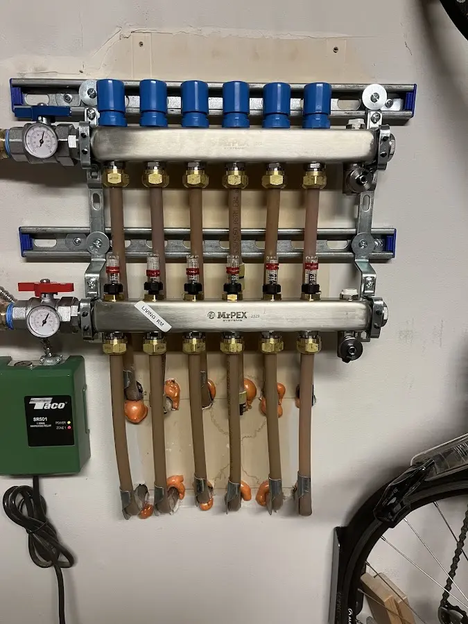 Plumber performing Water Heater Repair at a residential property in Hector